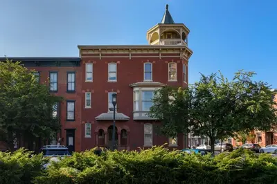 a red brick building with a tower on top of it at Capitol View Retreat - 2F Fast Wi-Fi Spacious in Harrisburg