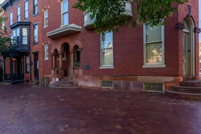 a red brick building on a brick street at Capitol View Retreat - 3F Fast Wi-Fi Cozy in Harrisburg