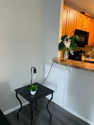 a small table in a room with a kitchen at Pet-Friendly 1BR Condo Free Parking, Discount! in Elkins Park