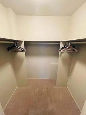 a walk in closet with two hangers at Pet-Friendly 1BR Condo Free Parking, Discount! in Elkins Park