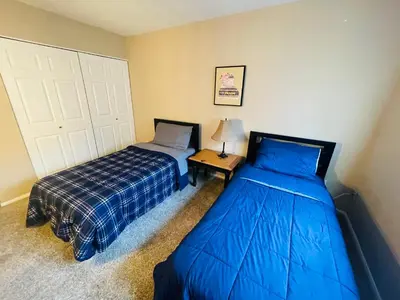 two beds sitting next to each other in a bedroom at Spacious 2BR2BA Monthly Discount in Elkins Park