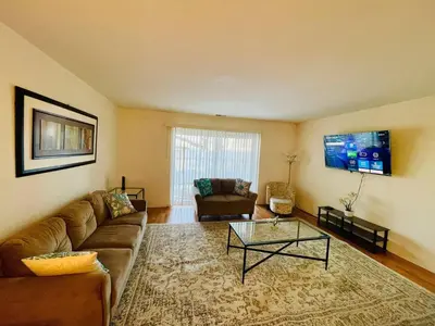 a living room with a couch and a coffee table at Bright & Spacious 2BR2BA Monthly Savings in Philadelphia