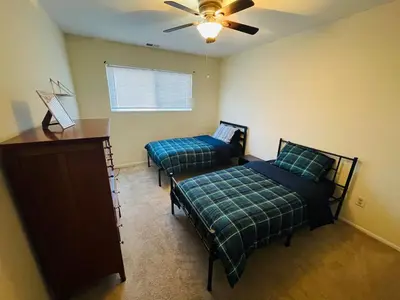 a bedroom with two beds and a ceiling fan at Renovated 2BR 2BA Monthly Savings in Philadelphia