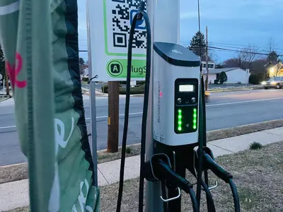 a pay phone is hooked up to a pole at Renovated 2BR 2BA Monthly Savings in Philadelphia