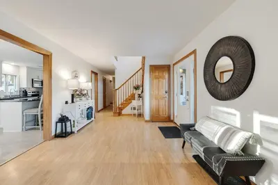 a living room with a couch and a kitchen at Mansion in the Hills with Pool in Monroe