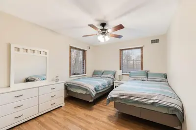 a bedroom with two beds and a ceiling fan at Mansion in the Hills with Pool in Monroe