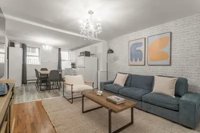 a living room with a couch and a table at Spacious 3BR Apartment in Kips Bay - Central Manhattan Location! in New York