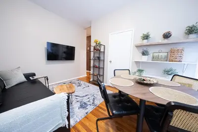 a living room with a table and a couch at Spacious 3BR Near Columbia Uni & Riverside Park in New York