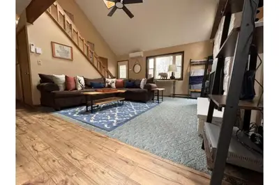 a living room with a couch and a table at Sweet Darlene with Hot Tub, Game Room and Pet Friendly in Albrightsville