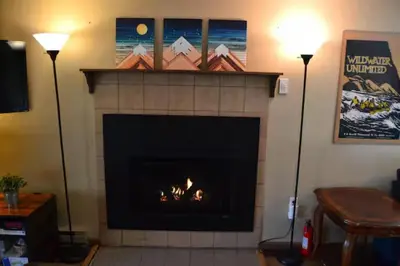a fireplace in a living room with a fire place at Sweet Darlene with Hot Tub, Game Room and Pet Friendly in Albrightsville