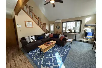 a living room with a couch and a coffee table at Sweet Darlene with Hot Tub, Game Room and Pet Friendly in Albrightsville