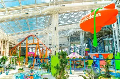 a large indoor water park with a roller coaster at 20 minutes to Central Park Manhattan New York City 16 mins Metlife stadium in West New York