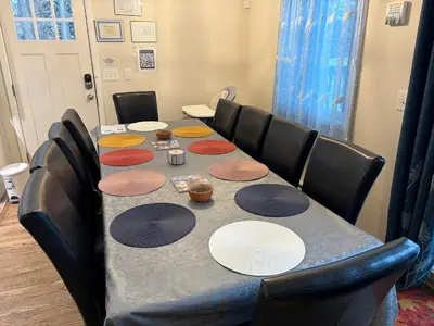 a table in a room with chairs around it at Evergreen Escapes 4 BR with Game Room, Firepit near Kalahari and Camelback in Long Pond