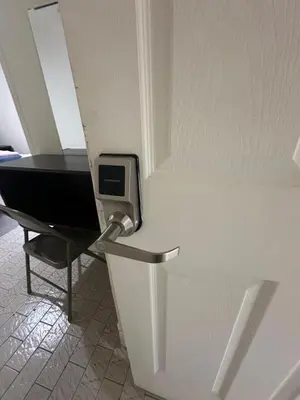 a door with a desk and a chair in a room at Al Demashqi in New York
