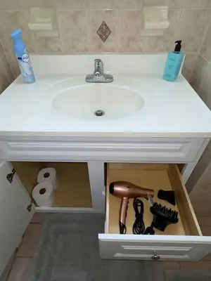 a bathroom sink with a box under it at Cozy 2 Bedrooms 1and half Bathrooms Near Prudential with Parking Entire Apartment in Newark