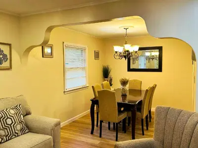 a dining room with a table and chairs at Cozy Riverside View House in Montague