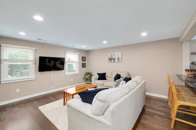 a living room with two couches and a table at Cozy Full Home with Parking, 10min Walk to Bridge St in Phoenixville