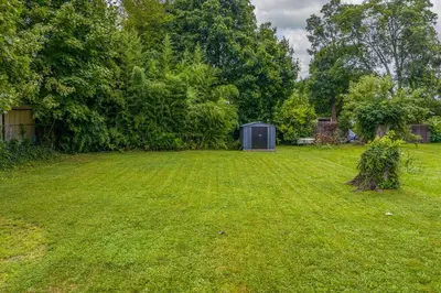 a yard with a shed in the middle of it at Cozy Full Home with Parking, 10min Walk to Bridge St in Phoenixville