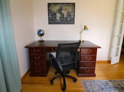 a desk with a chair next to a desk with a desk at Private Oasis Ranch • In Town Princeton • 2BR/2B in Princeton