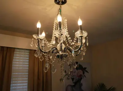a chandelier hanging from a ceiling in a room at Private Oasis Ranch • In Town Princeton • 2BR/2B in Princeton