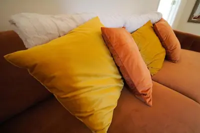a pile of pillows sitting on a couch at Private Oasis Ranch • In Town Princeton • 2BR/2B in Princeton