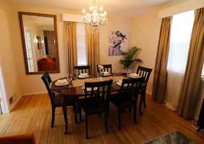 a dining room with a table and chairs and a mirror at Private Oasis Ranch • In Town Princeton • 2BR/2B in Princeton
