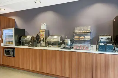 a counter in a restaurant with food on it at Microtel Inn & Suites by Wyndham Philadelphia Airport Ridley Park in Ridley Park
