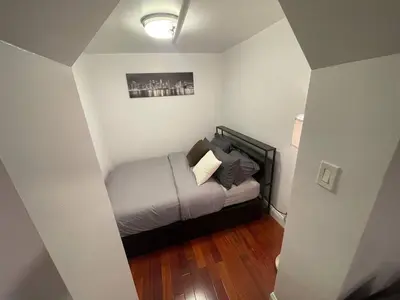 a small bedroom with a bed in a room at Private Studio Apartment in Union Square in New York