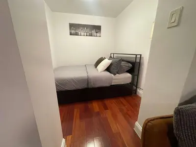 a small bedroom with a bed in a room at Private Studio Apartment in Union Square in New York