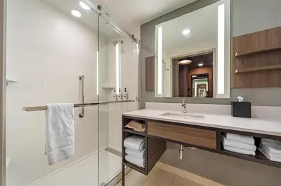 a bathroom with a sink and a shower at Hilton Garden Inn Media in Media