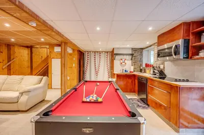 a kitchen with a pool table in a room at Stunning! Pocono Escape! HotTub Sauna Pool Ski Pet-Friendly Firepit Game Room Fireplace BBQ Lakes Tennis Fishing in Long Pond