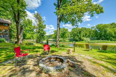 a group of chairs sitting around a fire pit at 25 Mi to Elk Mtn Skiing! Susquehanna River Cabin