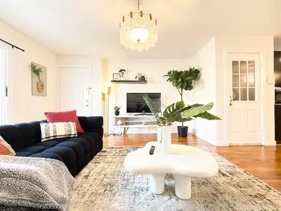 a living room with a couch and a coffee table at Luxury 3BR 2BA Retreat NYC Getaway Free Parking in Jersey City