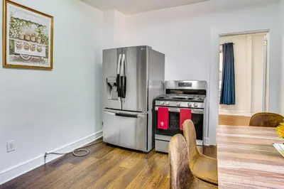 a kitchen with a stainless steel refrigerator and a stove at Walkable Location Pet-Friendly Apartment in Lodi! in Lodi