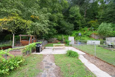 a park with a bench and a fence at Spacious Broadway Home Downtown Western Modern Charm with parking in Jim Thorpe