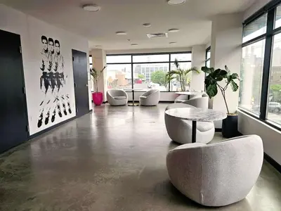 a room with chairs and a table in a building at Studio Apt with City View, Rooftop and Gym in Philadelphia