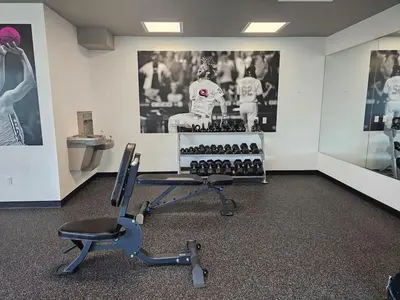 a waiting room with a chair and a sink at Boutique Studio with Rooftop View and Gym in Philadelphia