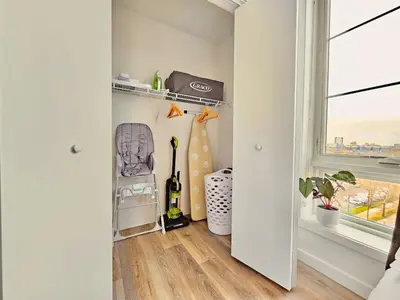 a hallway with a room with a window at 2 BR in the heart of an old city in Philadelphia