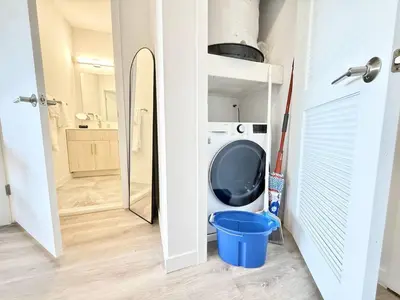a bathroom with a washing machine in a room at Central Philly 1Br Apt with Gym in Philadelphia