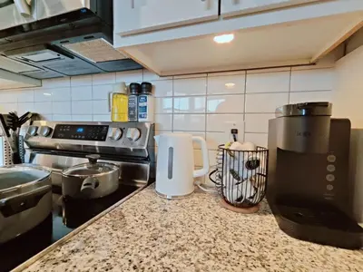 a kitchen with a counter top with a appliance on it at Cozy Philly Studio with Free Parking for Long Term Stays in Philadelphia