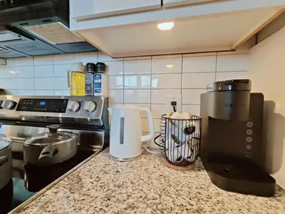 a kitchen with a counter with a coffee maker on it at Cozy Philly Studio with Free Parking for Long Term Stays in Philadelphia