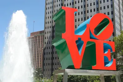 a large red exit sign in front of a fountain at Cozy Philly Studio with Free Parking for Long Term Stays in Philadelphia