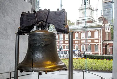 a large bell is on display in a city at Cozy Philly Studio with Free Parking for Long Term Stays in Philadelphia