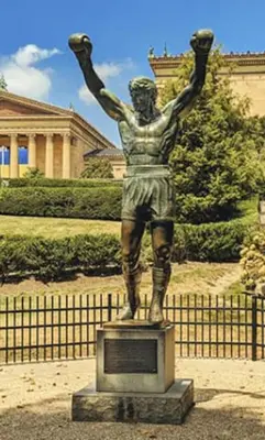 a statue of a man with his arms in the air at Cozy Philly Studio with Free Parking for Long Term Stays in Philadelphia