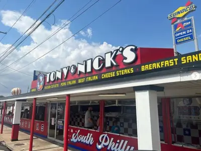 a fast food restaurant with a sign on the front of it at Quaint and Stylish APT with King Bed for Long Term Stay in Philadelphia