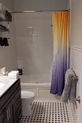 a bathroom with a tub and a toilet and a shower at Old City Apt Near Independent Hall and Liberty Bell in Philadelphia