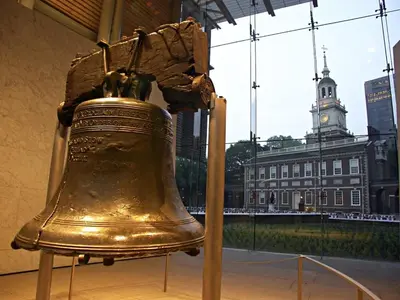 a large liberty bell in a building with a clock tower at Chic Apartment with King Bed in Old City in Philadelphia