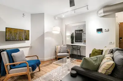 a living room with a couch and two chairs at Chic Apartment with King Bed in Old City in Philadelphia