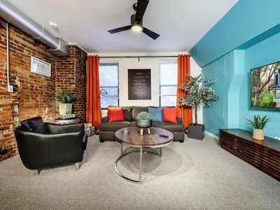 a living room with a couch and a table at Charming 1BR in Philly with Courtyard View in Philadelphia