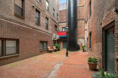 an empty courtyard in an old brick building at Charming 1BR in Philly with Courtyard View in Philadelphia